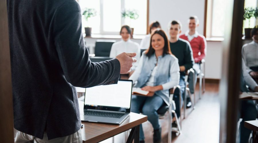 cheerful-mood-group-people-business-conference-modern-classroom-daytime (1)